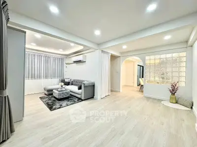 Spacious modern living room with elegant decor and ample natural light