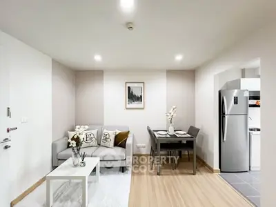 Modern living room with stylish decor and dining area in open layout apartment.