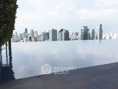 Stunning rooftop infinity pool with breathtaking city skyline view.