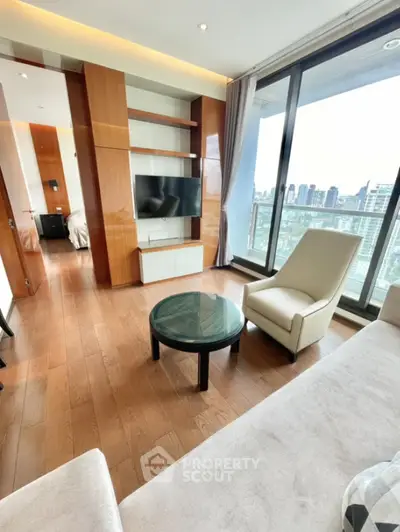 Modern living room with city view, featuring sleek furniture and floor-to-ceiling windows.