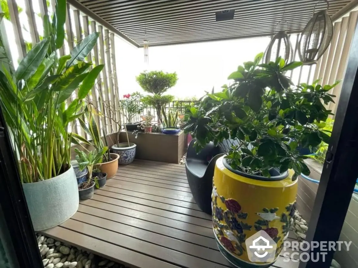 Charming balcony with lush greenery and stylish planters, perfect for relaxation and enjoying nature.