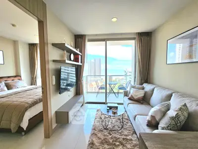 Modern living room with balcony and ocean view in luxury apartment