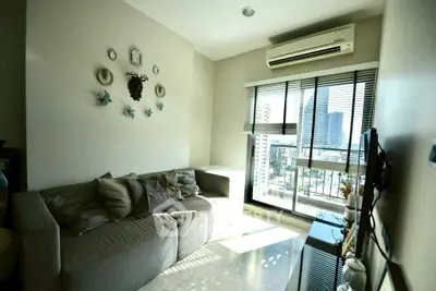 Chic living room with modern decor and city view from large window