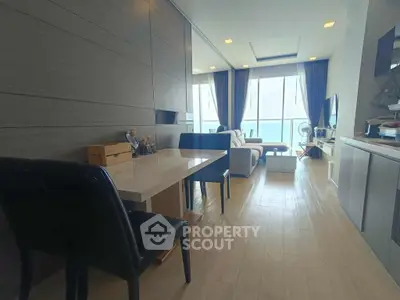 Modern living room with sleek design and large windows offering natural light.