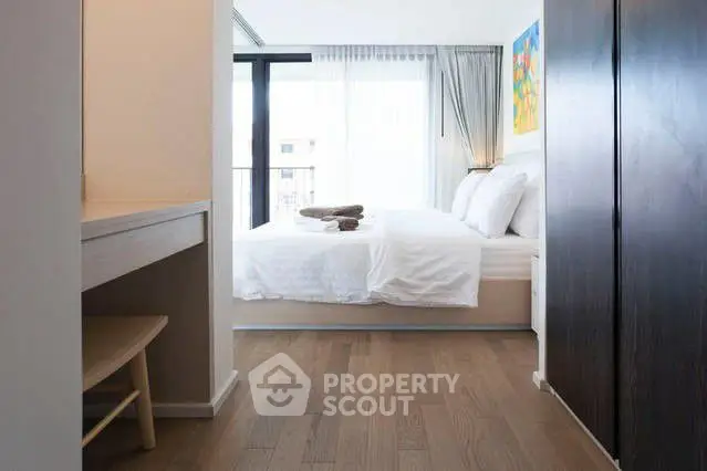 Modern bedroom with natural light and stylish decor