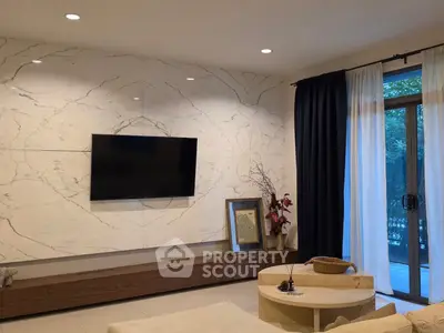 Elegant living room with marble accent wall and modern decor