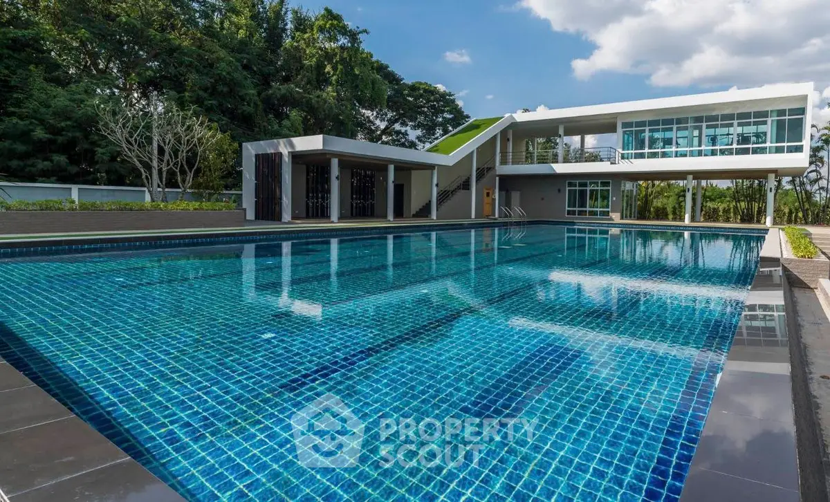 Luxurious modern property with a stunning outdoor pool and sleek architectural design, perfect for relaxation and entertainment.