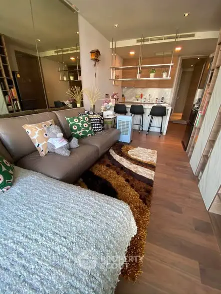 Stylish modern living room with cozy decor and open kitchen layout