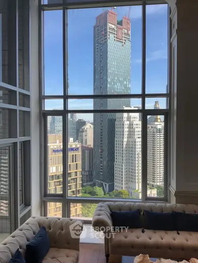 Luxurious living room with stunning cityscape view through large windows, featuring elegant sofas and modern design.