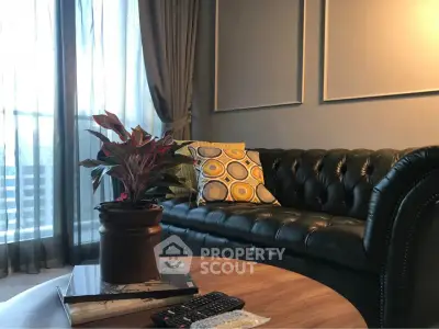 Stylish living room with leather sofa and modern decor, perfect for cozy evenings.