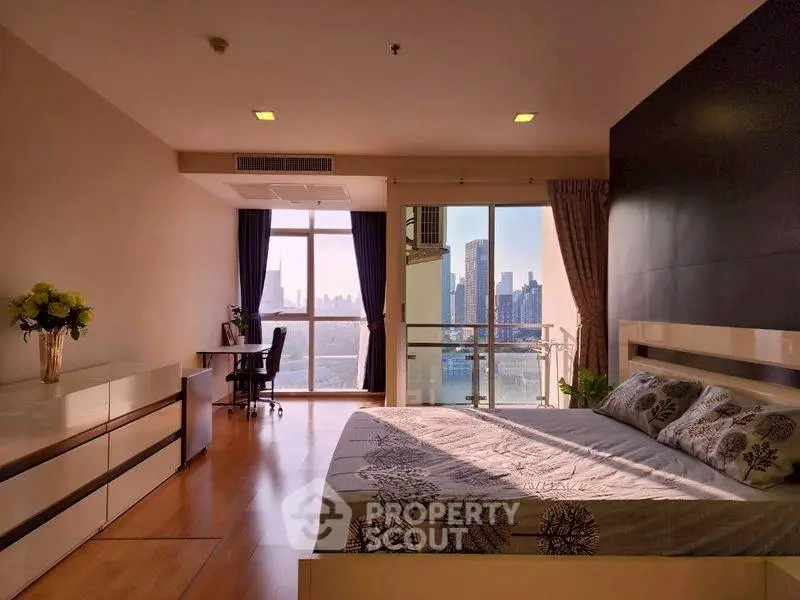 Spacious bedroom with stunning city view and modern decor