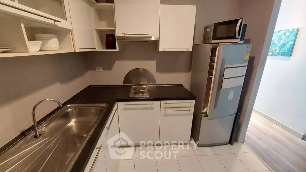 Modern kitchen with sleek cabinetry and stainless steel appliances