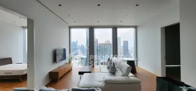 Luxurious high-rise living room with stunning city views and modern furnishings.