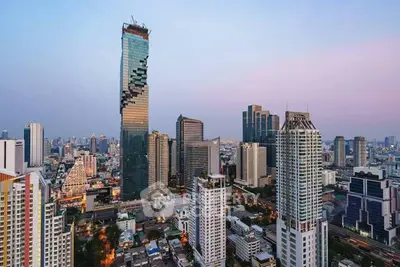 Stunning cityscape view with iconic skyscraper at sunset, showcasing urban architectural marvels.