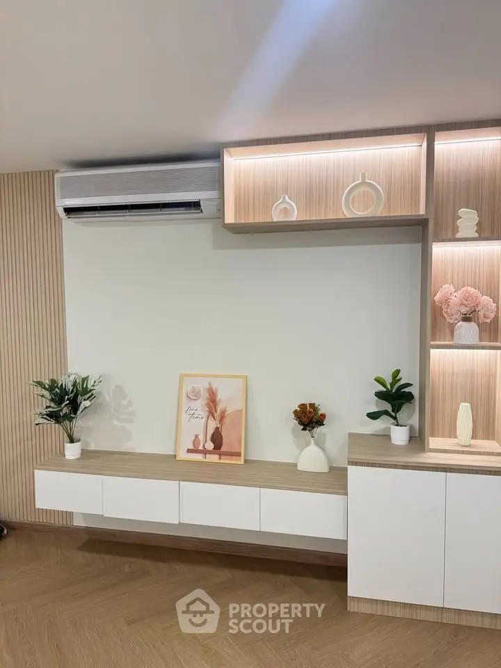 Modern living room with stylish shelving and air conditioning unit