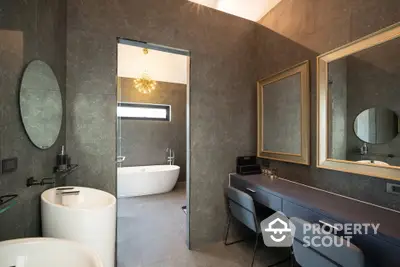 Luxurious modern bathroom with elegant fixtures and freestanding bathtub