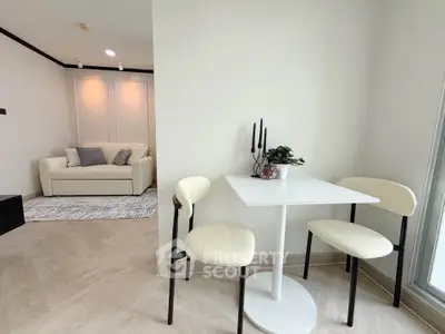 Modern living room with cozy seating and elegant dining area