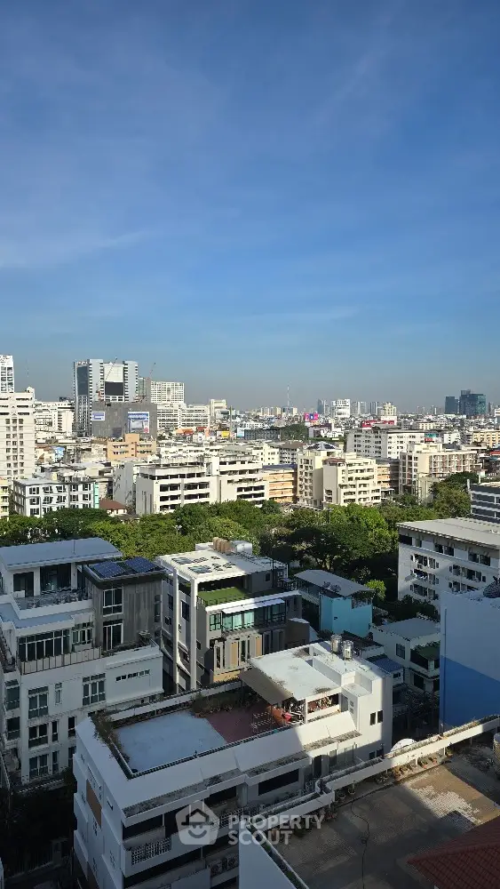 Stunning cityscape view from high-rise building showcasing urban skyline and architecture.