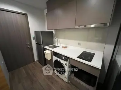 Modern compact kitchen with sleek appliances and efficient layout