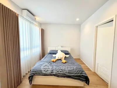 Cozy bedroom with modern decor and ample natural light