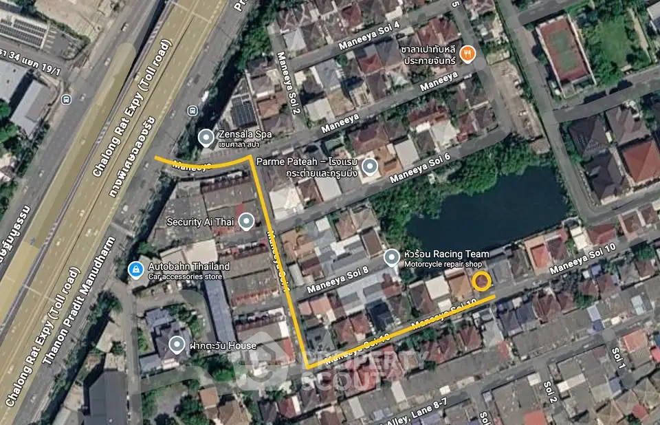 Aerial view of residential neighborhood with marked route in urban area.