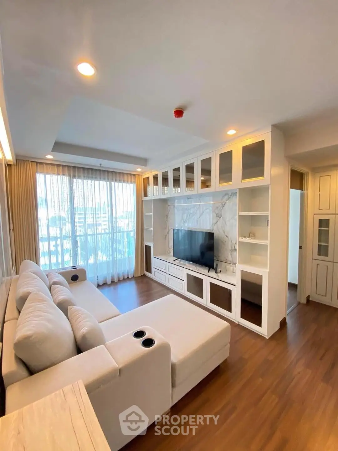 Spacious living room with modern sofa and built-in entertainment center
