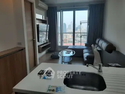Modern living room with city view, sleek furniture, and open layout.