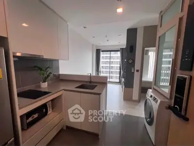 Modern kitchen with sleek design and integrated appliances in urban apartment