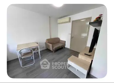 Modern living room with sleek furniture and air conditioning in a cozy apartment.