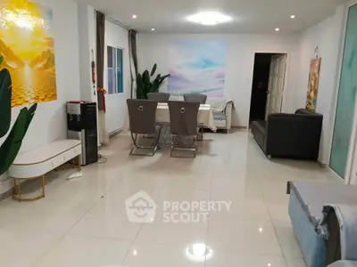 Spacious modern living room with elegant dining area and stylish decor