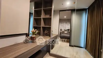 Modern bedroom with stylish shelving and mirrored closet doors