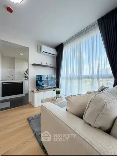 Modern living room with large windows and stylish decor