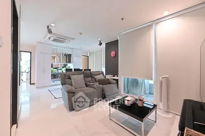 Modern living room with sleek furniture and open layout, perfect for contemporary living.