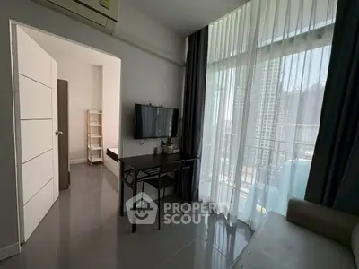 Modern living room with balcony view in high-rise apartment