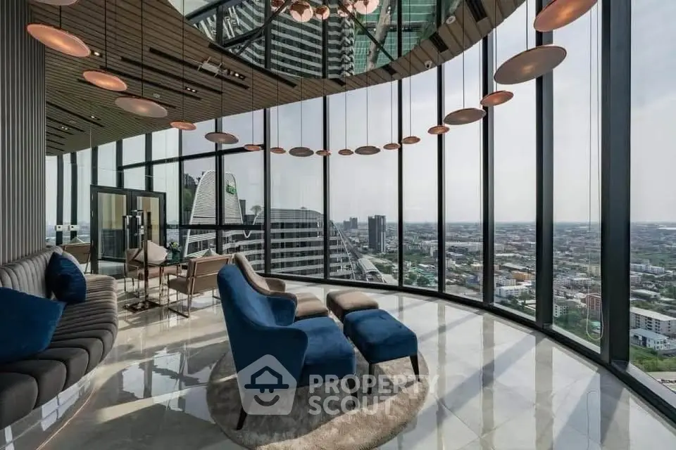 Luxurious high-rise living room with panoramic city views and elegant modern furnishings.