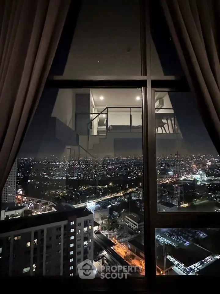 Stunning night cityscape view from high-rise apartment window, showcasing urban skyline and vibrant city lights.
