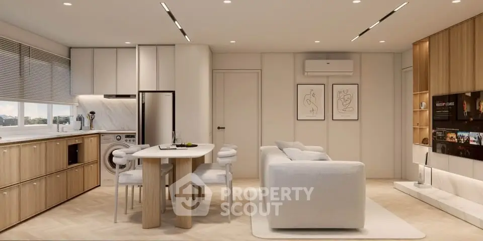 Modern open-plan living room with kitchen, featuring sleek design and natural light.