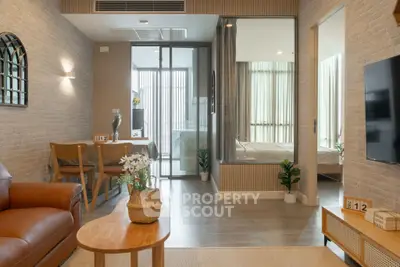 Modern open-plan living room with stylish decor and natural light