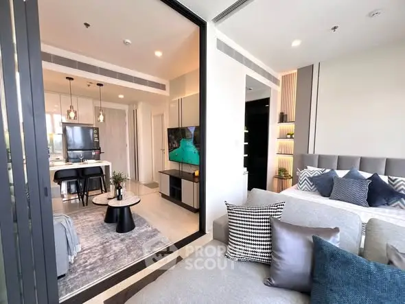 Modern open-plan living room with stylish decor and cozy seating area.
