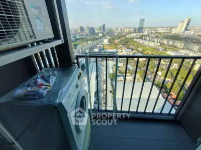 High-rise balcony with washing machine and stunning cityscape view