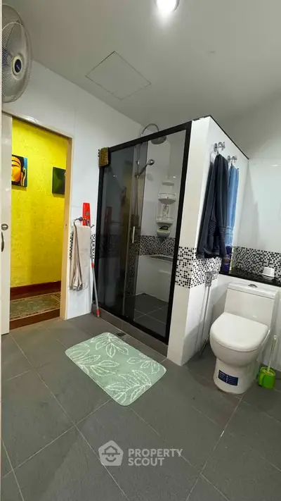 Modern bathroom with glass shower and stylish decor