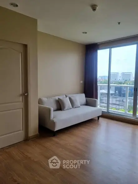 Modern living room with large window and city view