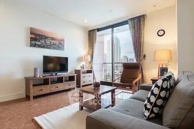 Spacious living room with city view, modern furniture, and large windows for natural light.