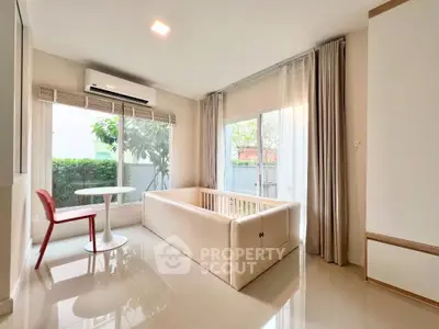 Bright and airy living room with modern furniture and garden view