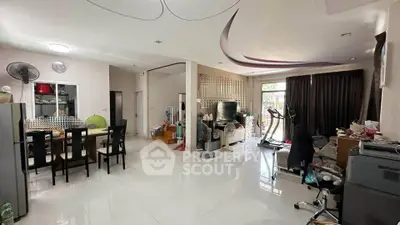 Spacious open-plan living area with modern decor and ample natural light