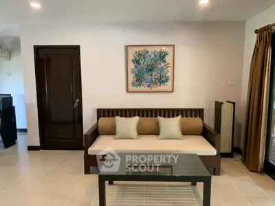 Modern living room with stylish sofa and elegant decor in a cozy apartment.