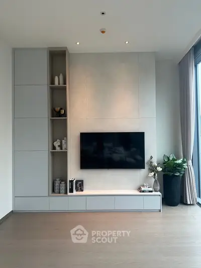 Modern living room with sleek TV setup and elegant decor