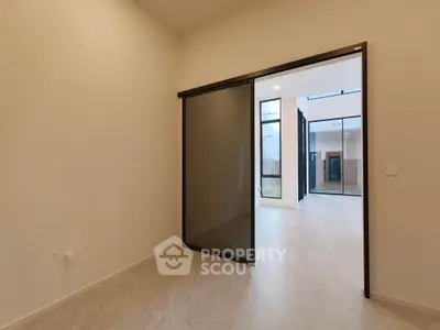 Spacious modern interior with sliding glass doors and elegant tile flooring