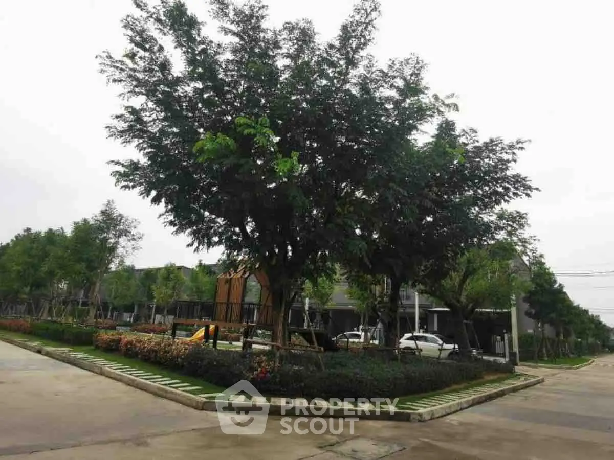 Charming residential neighborhood with lush greenery and modern architecture.