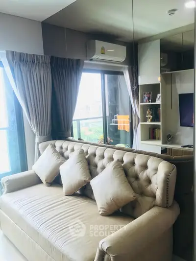 Stylish living room with plush sofa and large window view